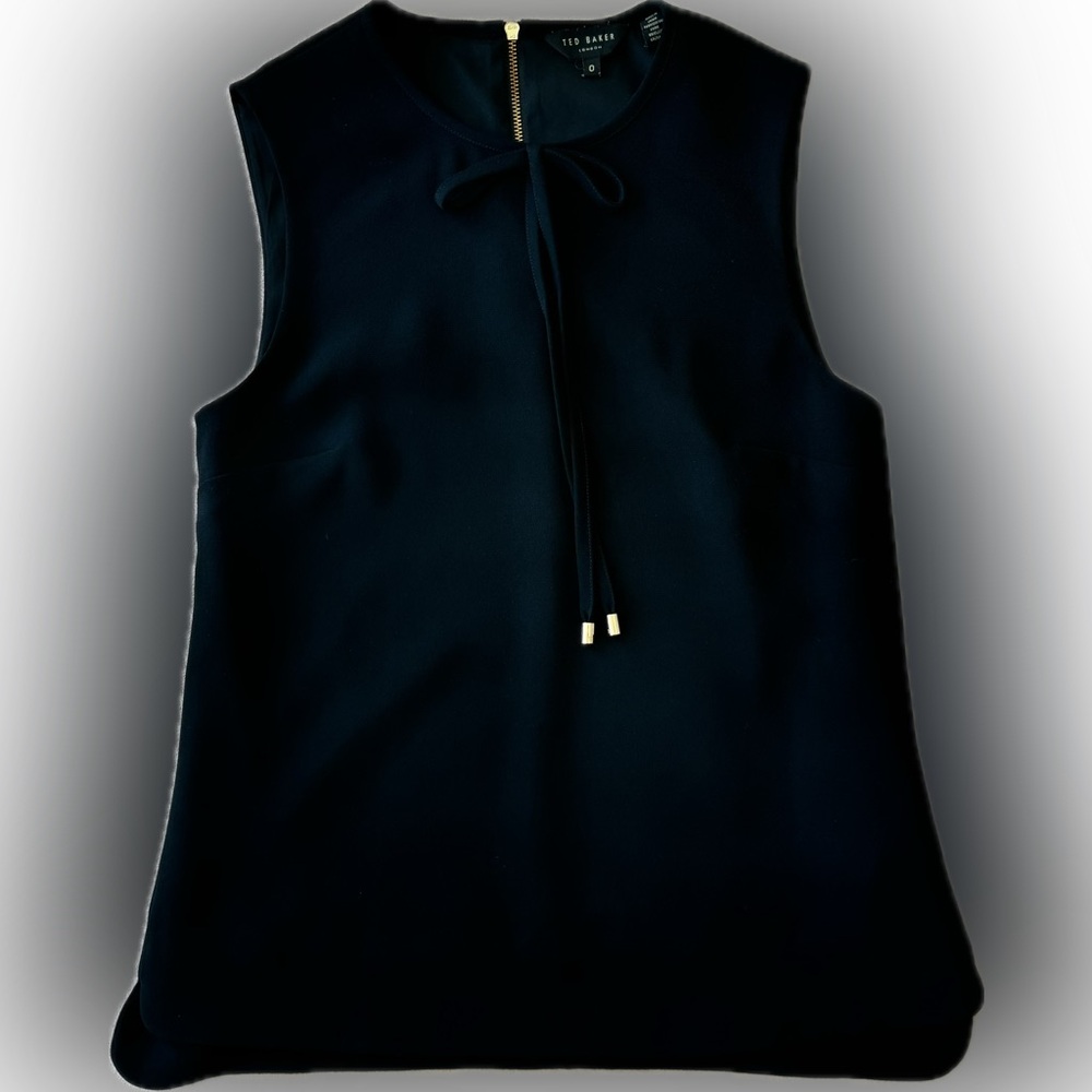 Black sleeveless blouse with bow